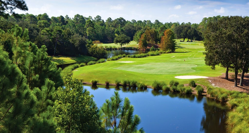 Panoramic view of a lush green golf course at Peninsula Golf & Racquet Club. Smooth