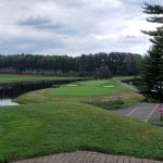 Panoramic view of a lush green golf course at Pequabuck Golf Club. Smooth