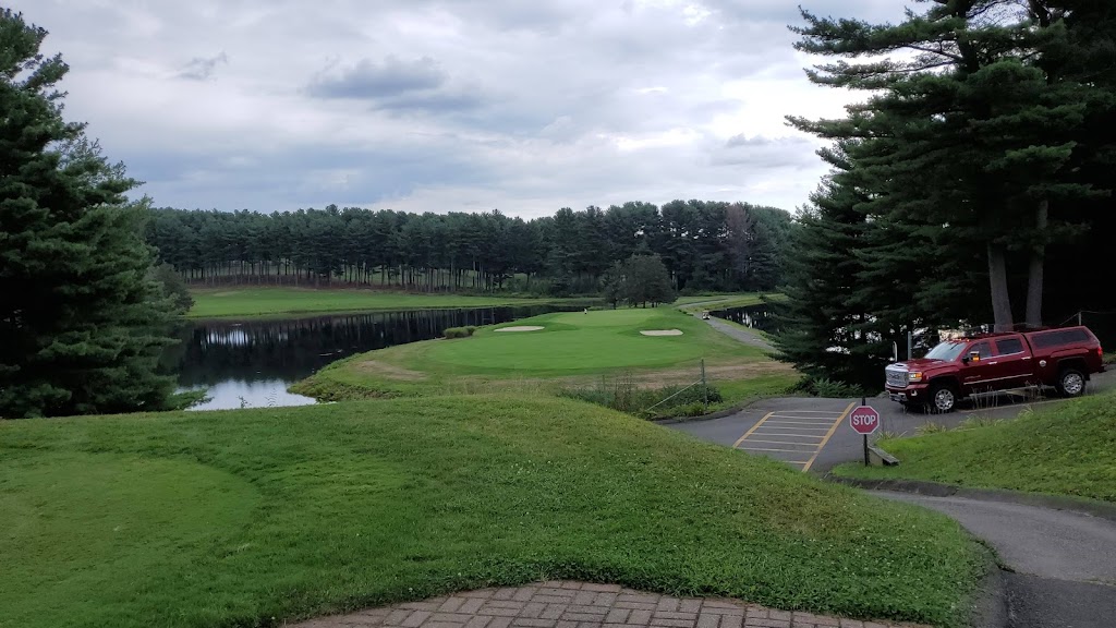 Panoramic view of a lush green golf course at Pequabuck Golf Club. Smooth