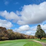 Panoramic view of a lush green golf course at Pequot Golf Club. Smooth