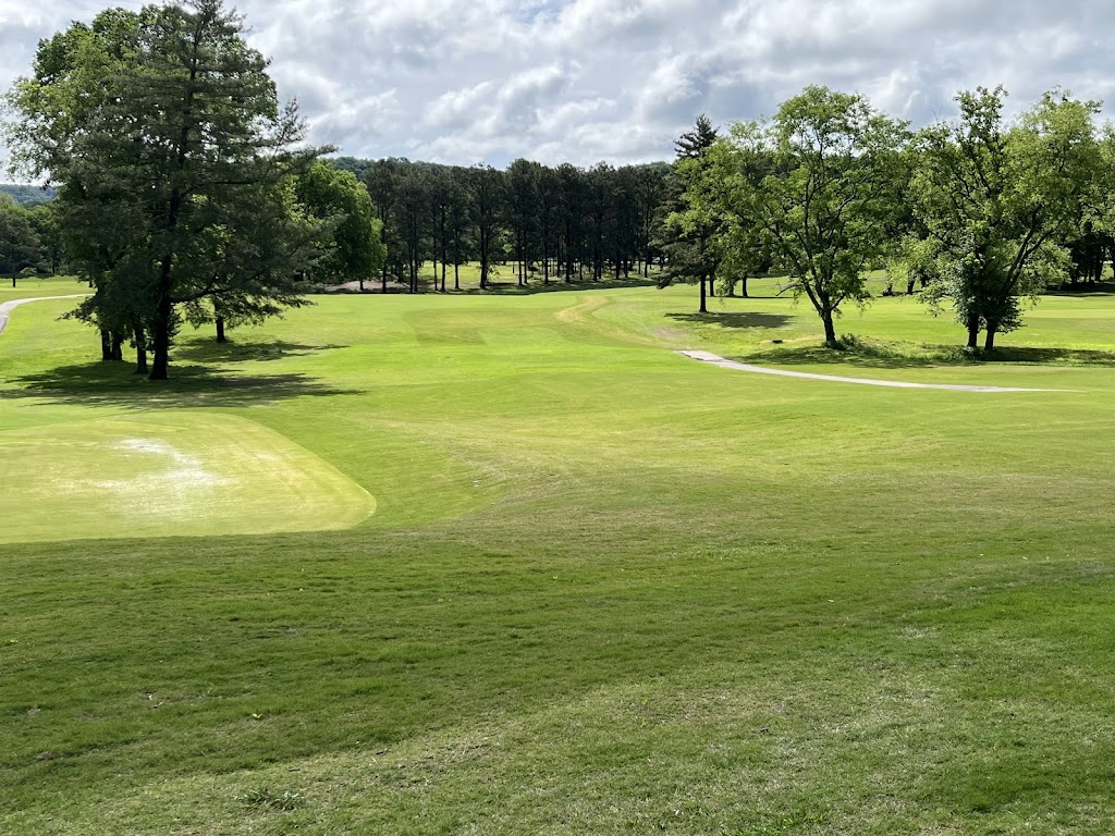 Panoramic view of a lush green golf course at Percy Warner Golf Course. Smooth