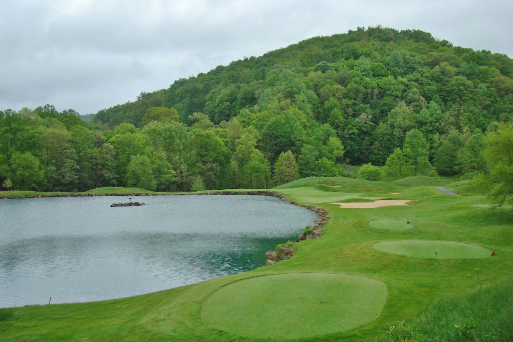 Panoramic view of a lush green golf course at Pete Dye Golf Club. Smooth