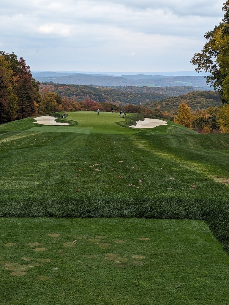 Panoramic view of a lush green golf course at Pikewood National Golf Club. Smooth