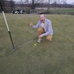 green grass with the flag in the hole.