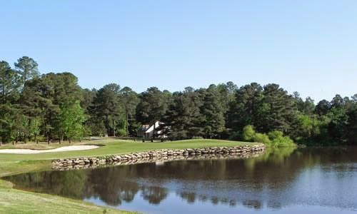 Panoramic view of a lush green golf course at Pine Hollow Golf Club. Smooth