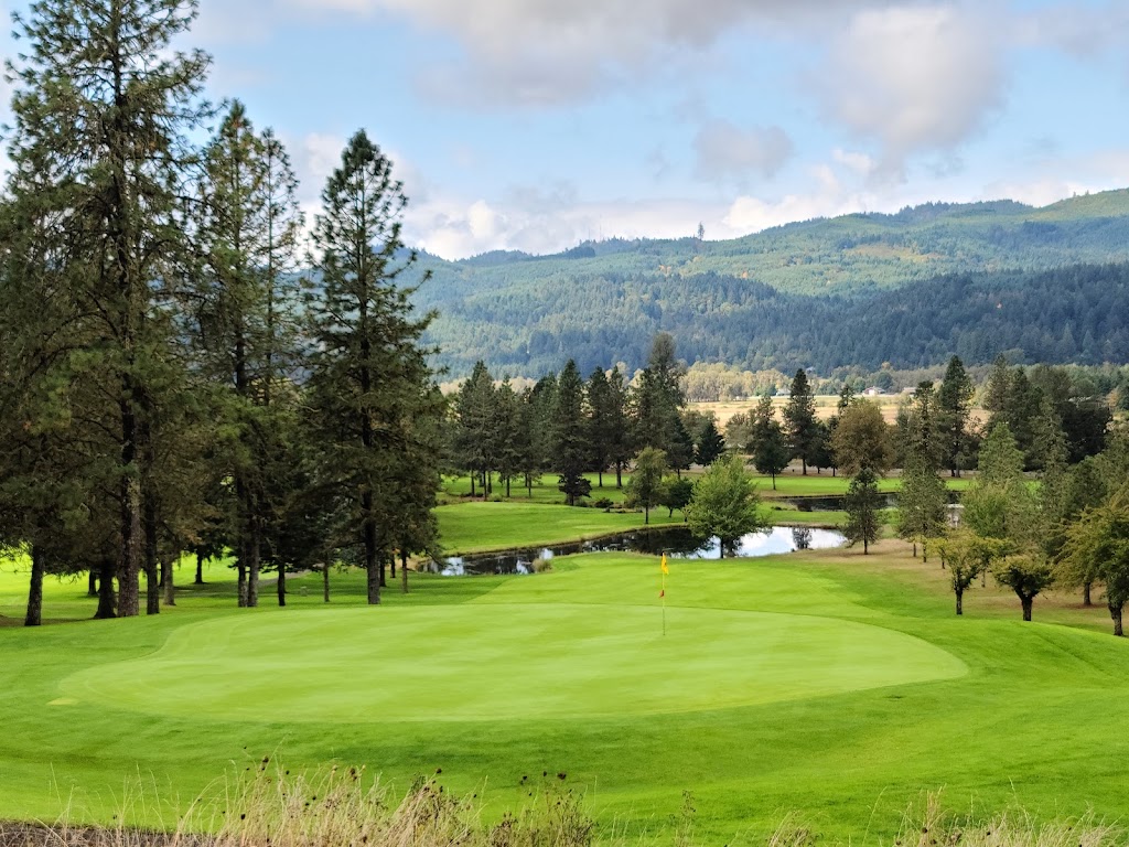Panoramic view of a lush green golf course at Pine Ridge Golf Club. Smooth