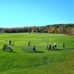 Panoramic view of a lush green golf course at Pine Ridge Municipal Golf Course. Smooth