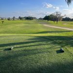 Panoramic view of a lush green golf course at Pinecrest Golf Club. Smooth