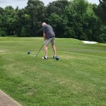 green grass with the flag in the hole.