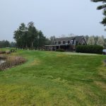 Panoramic view of a lush green golf course at Pinecrest Golf Course. Smooth