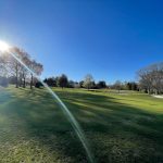 Panoramic view of a lush green golf course at Pinecrest Golf Course. Smooth
