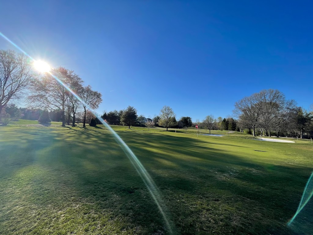 Panoramic view of a lush green golf course at Pinecrest Golf Course. Smooth