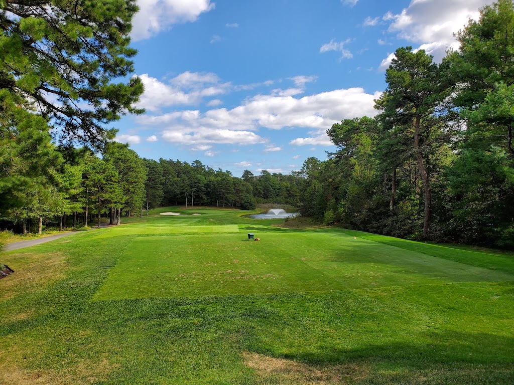 Panoramic view of a lush green golf course at Pinehills Golf Club. Smooth