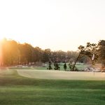 Panoramic view of a lush green golf course at Pinehurst No. 2. Smooth