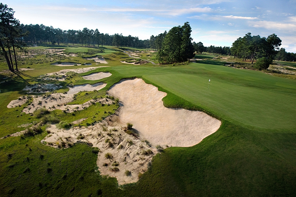 Panoramic view of a lush green golf course at Pinehurst No. 4. Smooth