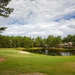 Panoramic view of a lush green golf course at Pinehurst No 6. Smooth