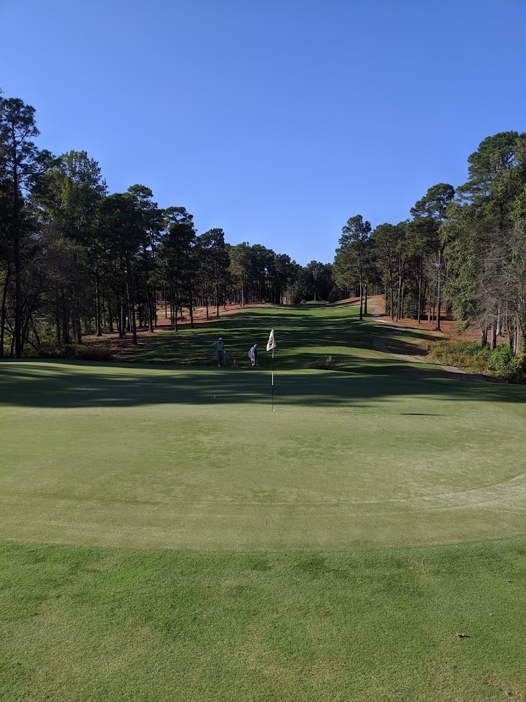 Panoramic view of a lush green golf course at Pinehurst No. 7. Smooth