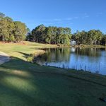 Panoramic view of a lush green golf course at Pinehurst No. 9. Smooth