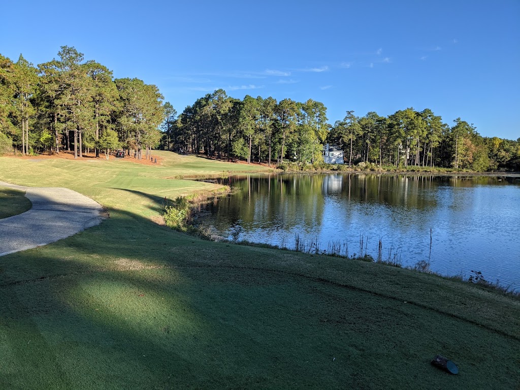 Panoramic view of a lush green golf course at Pinehurst No. 9. Smooth