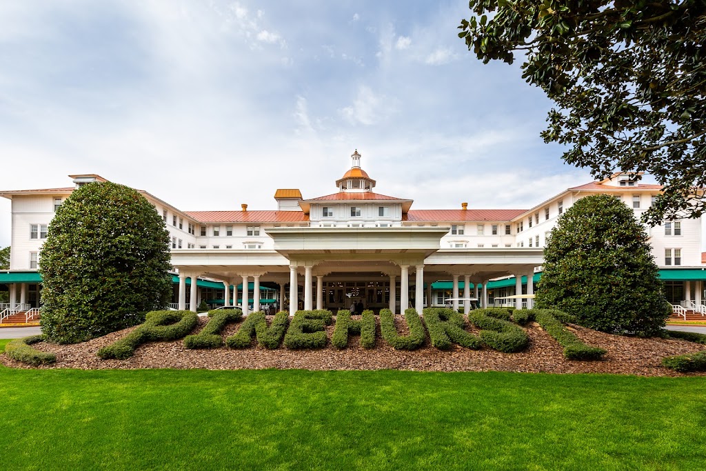 Panoramic view of a lush green golf course at Pinehurst Resort. Smooth