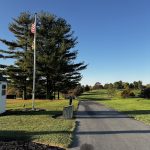 green grass with the flag in the hole.