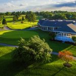 Panoramic view of a lush green golf course at Piney Branch Golf Course. Smooth