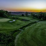 Panoramic view of a lush green golf course at Platteview Golf Club. Smooth