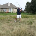 green grass with the flag in the hole.