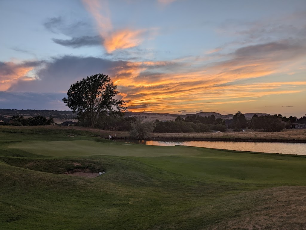 Panoramic view of a lush green golf course at Plum Creek Golf Club. Smooth