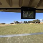 green grass with the flag in the hole.