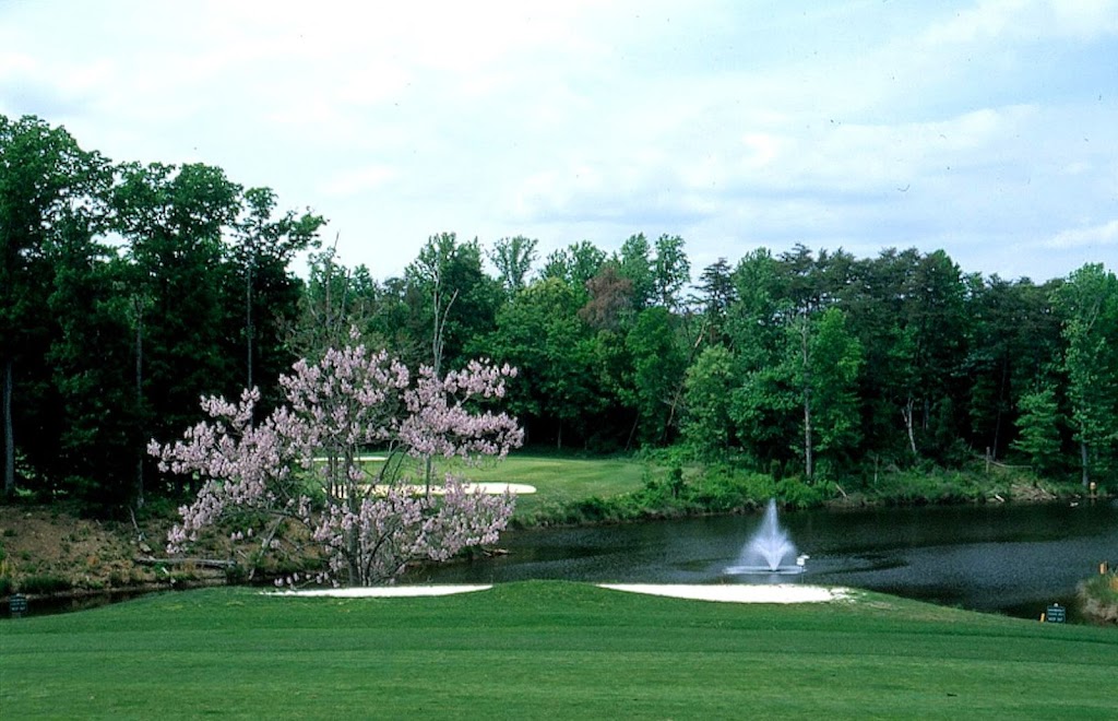 Panoramic view of a lush green golf course at Pohick Bay Golf Course. Smooth