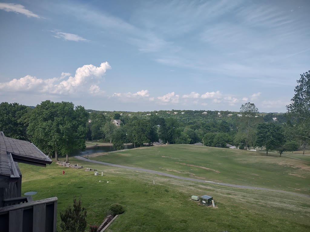 Panoramic view of a lush green golf course at Pointe Royale Village-Country. Smooth