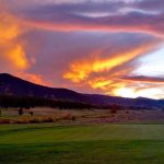 Panoramic view of a lush green golf course at Pole Creek Golf Club. Smooth