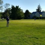 Panoramic view of a lush green golf course at Pomona Golf & Country Club. Smooth