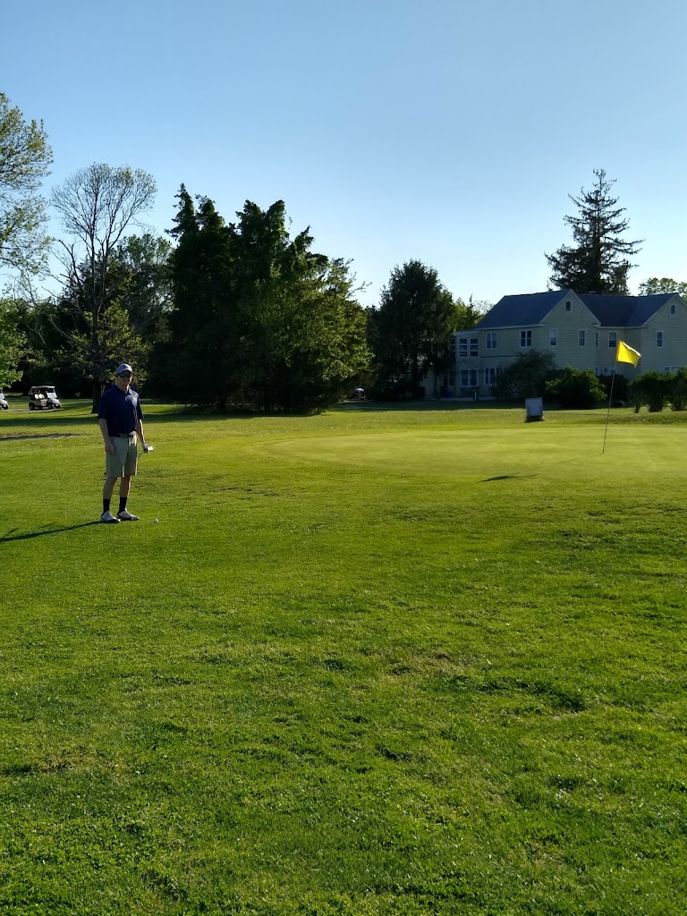 Panoramic view of a lush green golf course at Pomona Golf & Country Club. Smooth