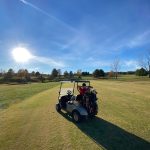 green grass with the flag in the hole.