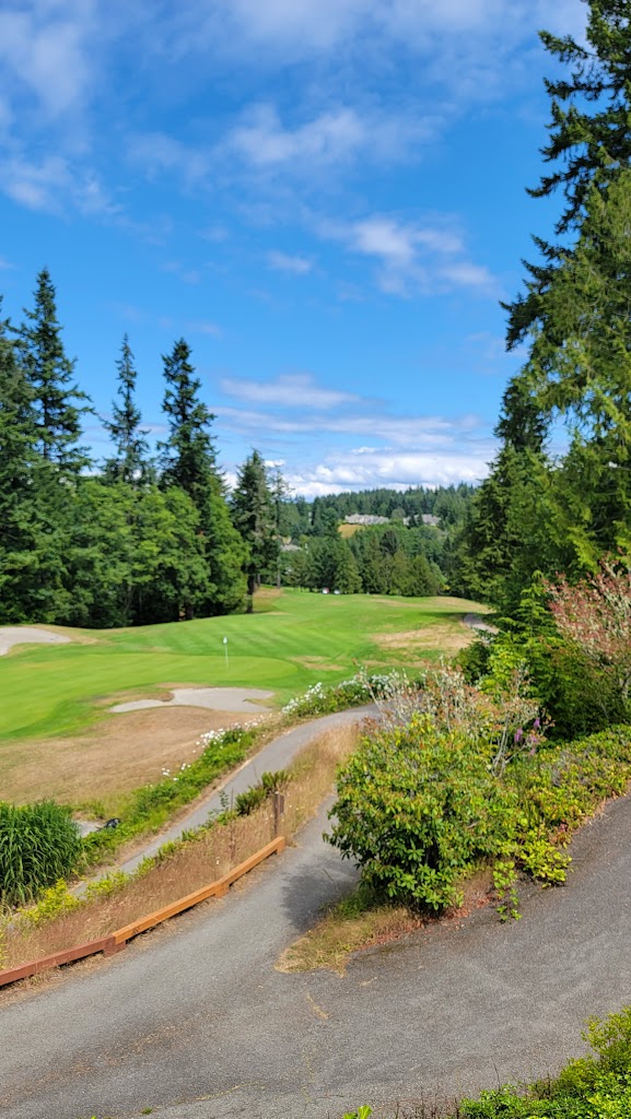 Panoramic view of a lush green golf course at Port Ludlow Golf Course. Smooth