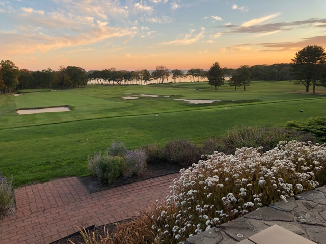 Panoramic view of a lush green golf course at Portland Country Club. Smooth