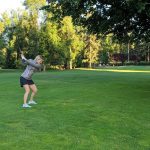 green grass with the flag in the hole.