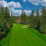 Panoramic view of a lush green golf course at Portland Golf Club. Smooth