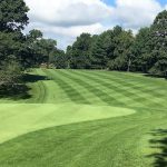 Panoramic view of a lush green golf course at Portland Golf Course. Smooth