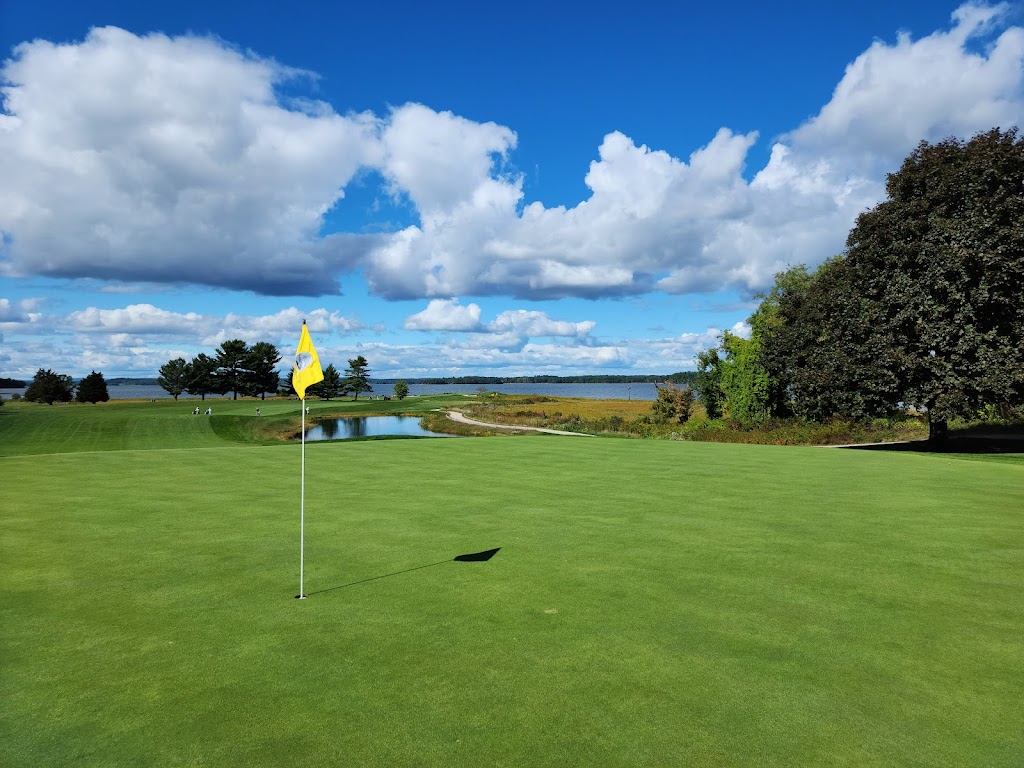 Panoramic view of a lush green golf course at Portsmouth Country Club. Smooth