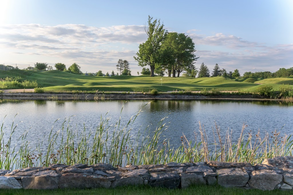 Panoramic view of a lush green golf course at Pound Ridge Golf Club. Smooth
