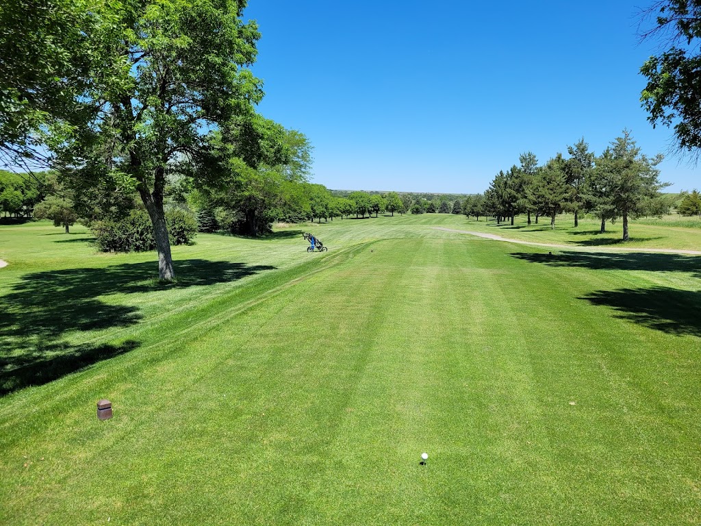 Panoramic view of a lush green golf course at Prairie Dog Golf Course. Smooth
