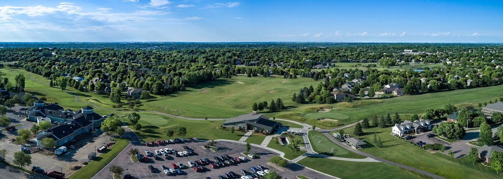 Panoramic view of a lush green golf course at Prairie Green Golf Course. Smooth