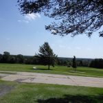 Panoramic view of a lush green golf course at Prairie Trails Public Golf Course. Smooth