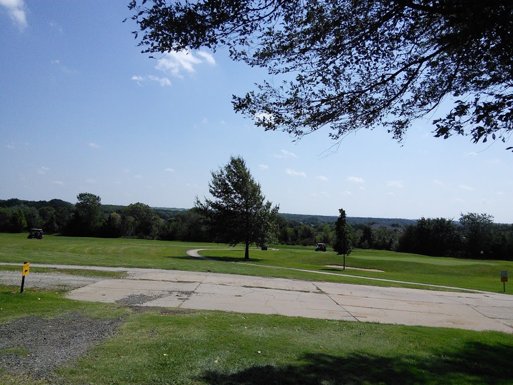 Panoramic view of a lush green golf course at Prairie Trails Public Golf Course. Smooth