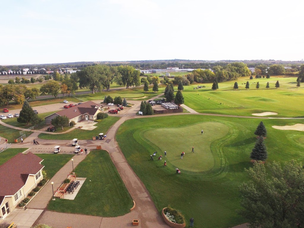 Panoramic view of a lush green golf course at Prairie West Golf Course. Smooth
