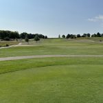 Panoramic view of a lush green golf course at PrairieView Golf Club. Smooth