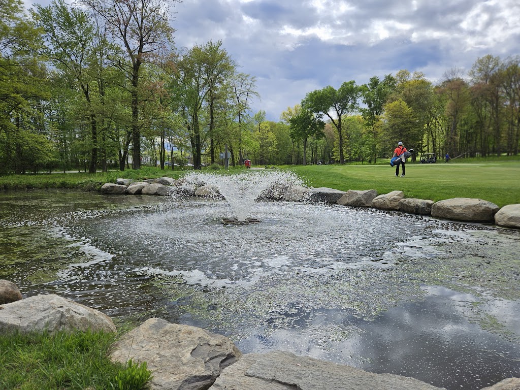 Panoramic view of a lush green golf course at Preakness Valley Golf Course. Smooth